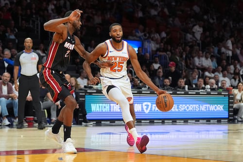 Powell scores 29 as Heat beat Knicks 115-107 in Miami’s home opener