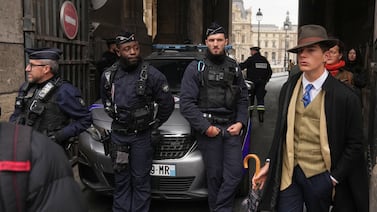 Inspector Clouseau? The mystery man in an AP photo after the Louvre jewel heist creates a buzz