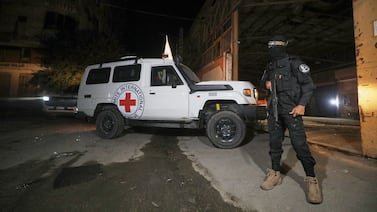 The Latest: Israel says one body handed over wasn't a hostage as aid trucks head for Gaza