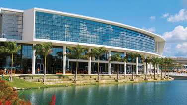 University of Miami students go back to class with a mask