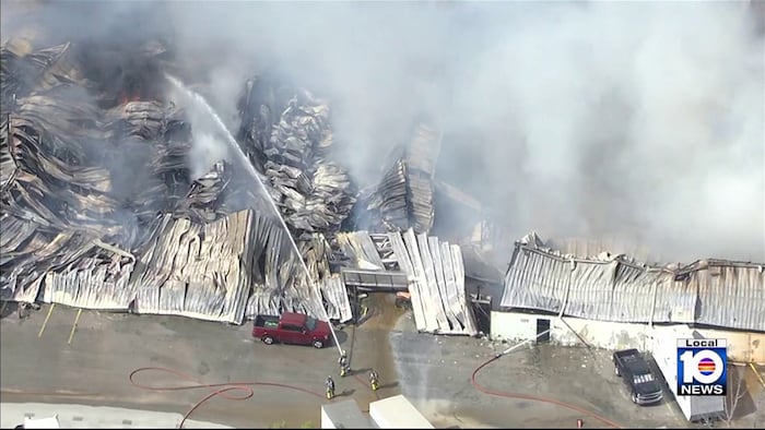 First responders continue battling fire at northwest Miami-Dade warehouse