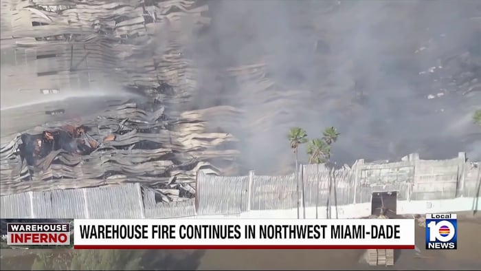 Crews continue to work on extinguishing northwest Miami-Dade warehouse fire