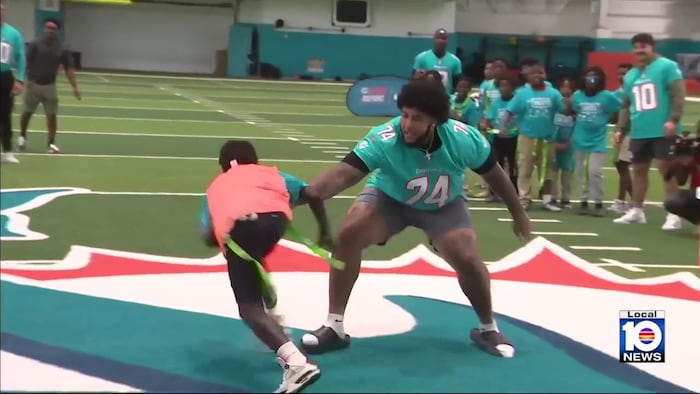 Dolphins rookies hit the field with Special Olympians at flag football camp