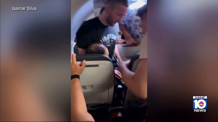 Passenger reacts after helping restrain suspect on flight that was diverted to MIA