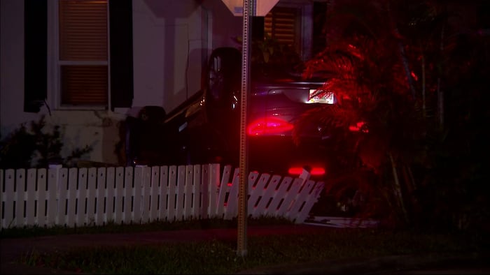 Hollywood rollover crash sends car into home, narrowly missing sleeping residents