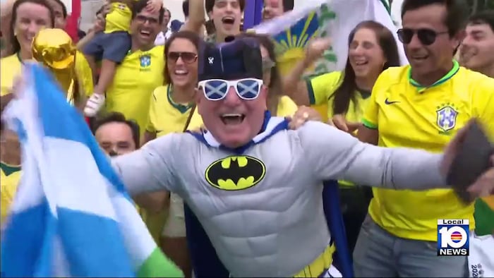 Brazilian and Scottish FIFA World Cup fans celebrate together at Miami Stadium’s fan zone