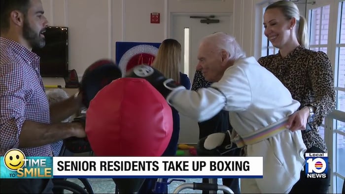 Assisted living facility residents with boxing gloves show age is just a number